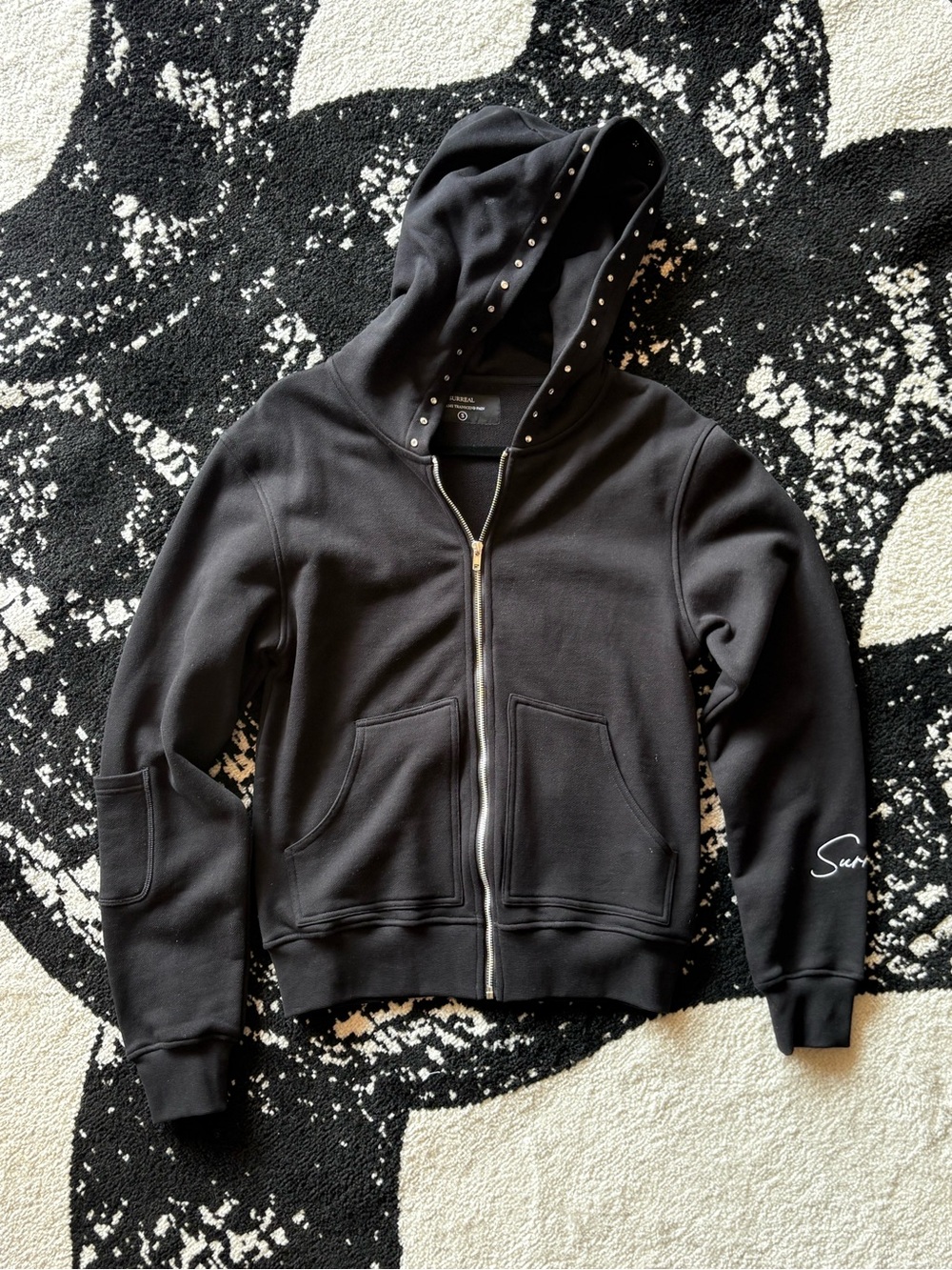 Surreal “over pain” zip-up hoodie (black)